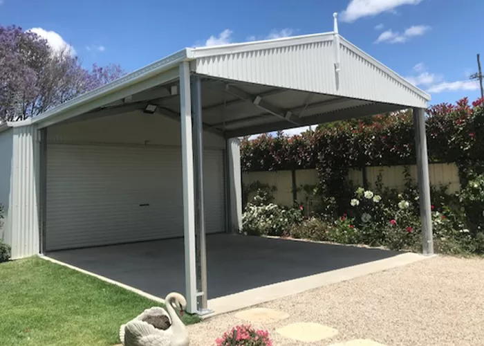 carport attached to garage with roller door