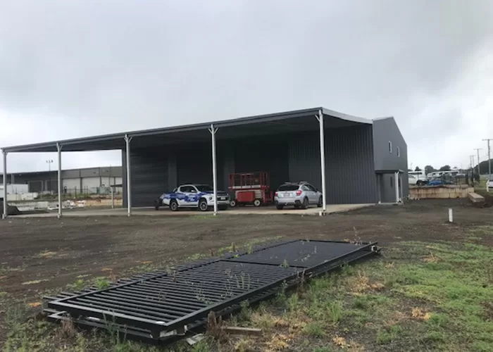 large dark grey industrial shed